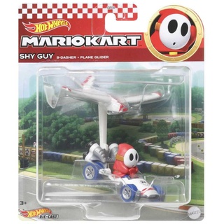 Hot Wheels Mario Kart Shy Guy B Dasher mit Flugzeug Glider Spielzeugfahrzeug für Kinder ab 3 Jahren im Maßstab 1:64 mit einem Segelflugzeug Zubehör